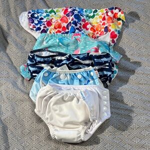 Set of 5 swim diapers various sizes 0-6 mos, 18 mos, 3t. Iplay Alvababy.